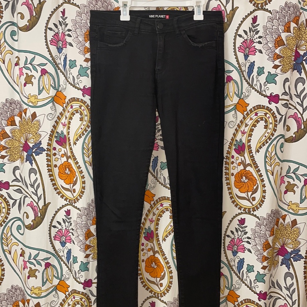 Boutique jeans with frayed bottoms